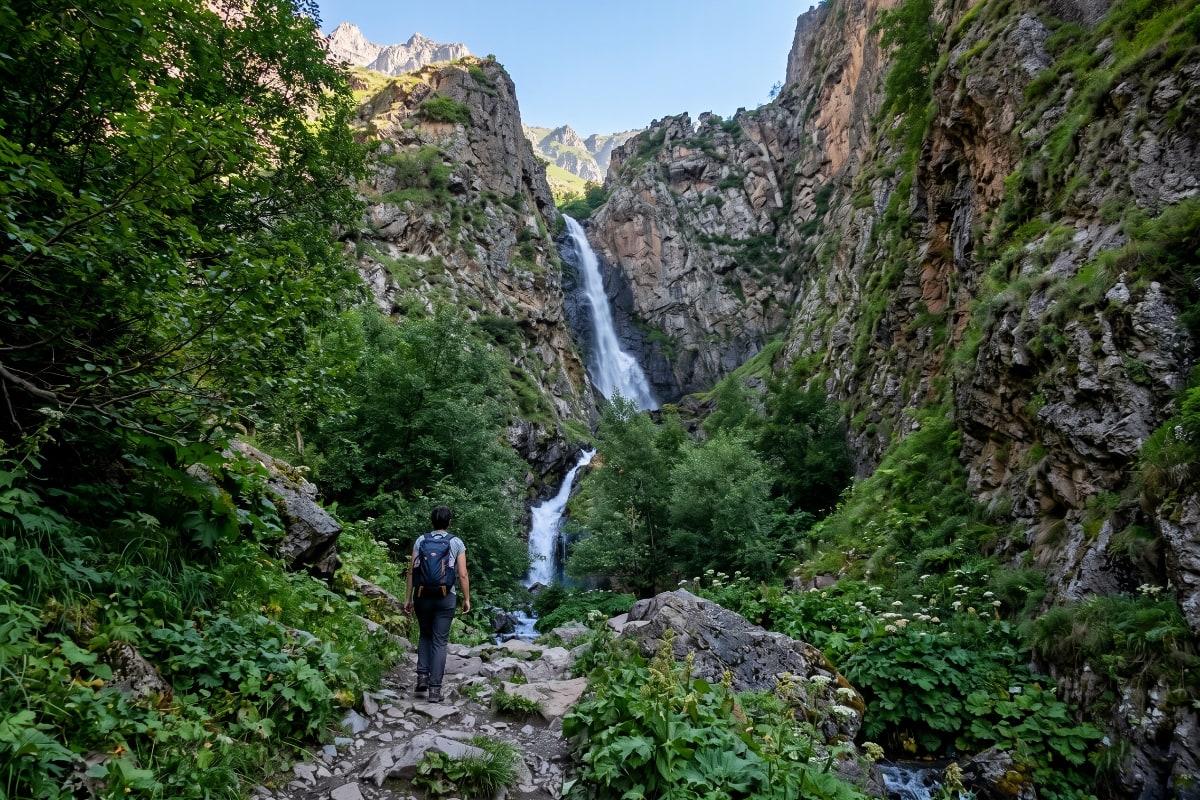 Gveleti Upper Waterfall cascading through a forested mountain gorge