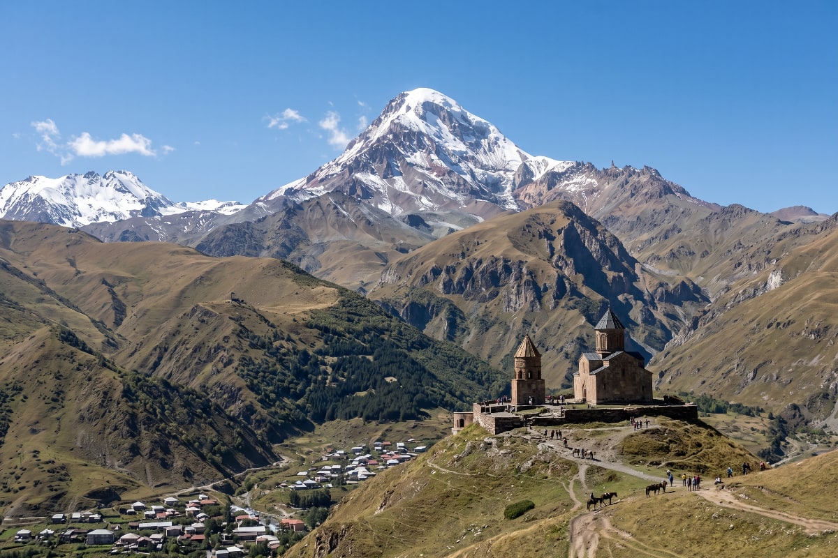 Snow-covered Mount Kazbek looming above the valley